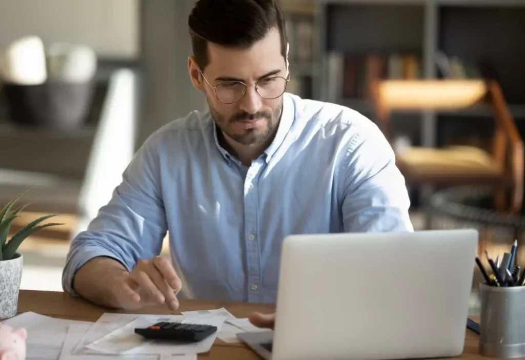 A man looking at the screen