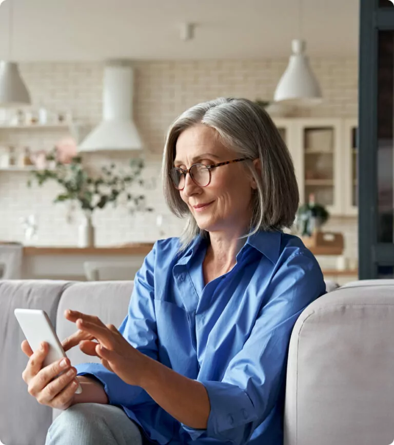 A woman looking at the screen